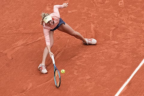 Anastasia Potapova plays a shot against Iga Swiatek